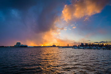 Dramatic sunset over the Patapsco River, at the Canton Waterfront, in Baltimore, Maryland.
