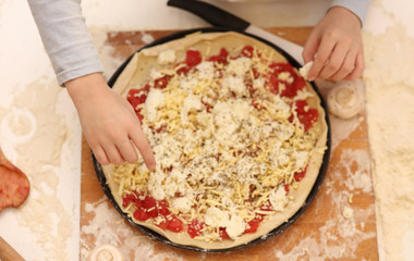 Preparing homemade pizza.