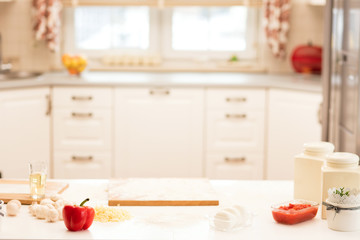 Ingredients for pizza on a table.