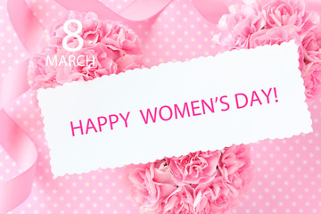 Happy women's day card on Pink carnation bouquet with pink ribbon