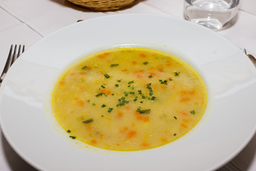 Soup with broth and carrots