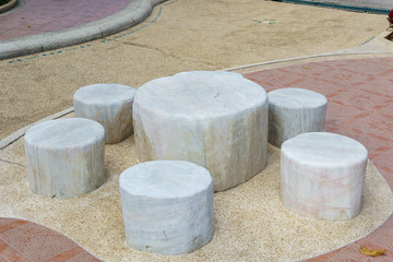 Marble stone garden bench in the park.