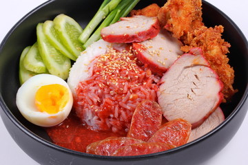 Jasmine rice with meat and boiled egg topped red sweet sauce .