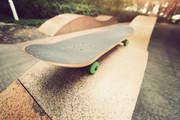 closeup of  skateboard at city skatepark waiting for riding