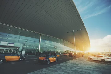 Printed roller blinds Airport Cabstand in front of modern airport doors in Barcelona, cabrank with a lot of taxis near windowed facade of contemporary Airport terminal in Spain with road, long ceiling and parking lot