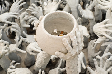 Obraz premium Hands Statue from Hell in Wat Rong Khun at Chiang Rai, Thailand