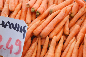Pictures of organic and healthy carrots on greengrocery

