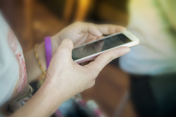 Women play smart phones