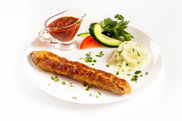 National meal chicken shish kebab with sauce isolated at white background.