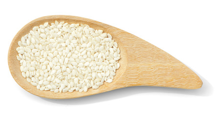 organic white sesame put in wooden spoon isolated