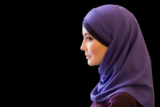 charming Muslim woman in a scarf on her head in profile