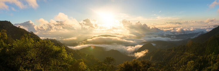 Fototapeta na wymiar Sunrise at Doi Ang Khang in Chiang Mai, Thailand. Clouds over the mountains. Panorama shot