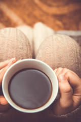 Woman with holding white cup of coffee