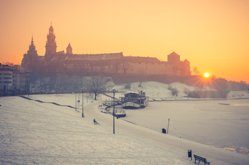 Krakow, Poland, Wawel Castle and Wawel cathedral in the winter over frozen Vistula river in the morning