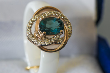 ring with a blue stone in box