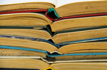 Stack of old open books. Books background