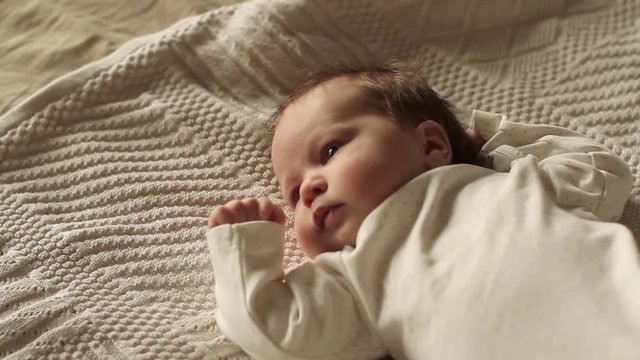 Beautiful Baby Lying on the Bed