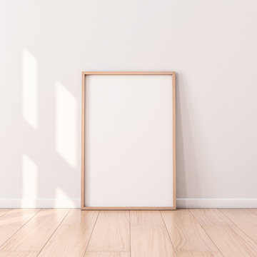 Poster with Wooden Frame Mockup standing on the floor. 3d rendering