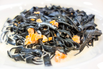 tasty pasta with salmon on a the table