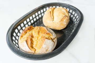 bread in basket - little roll breads in basket on table