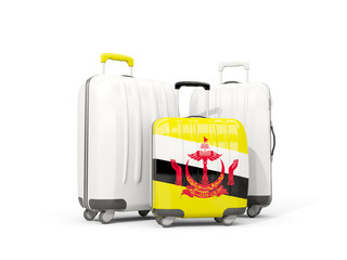 Luggage with flag of brunei. Three bags isolated on white
