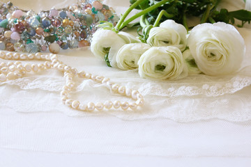white delicate lace fabric and white flowers