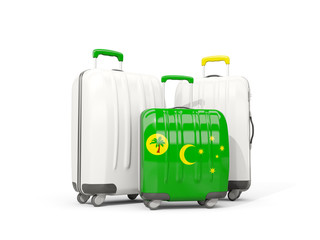 Luggage with flag of cocos islands. Three bags isolated on white