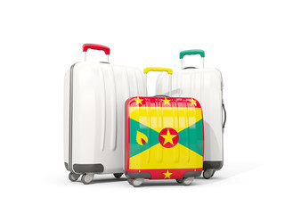 Luggage with flag of grenada. Three bags isolated on white