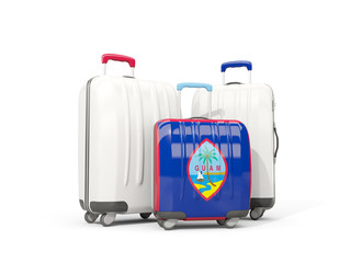 Luggage with flag of guam. Three bags isolated on white