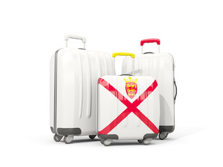 Luggage with flag of jersey. Three bags isolated on white