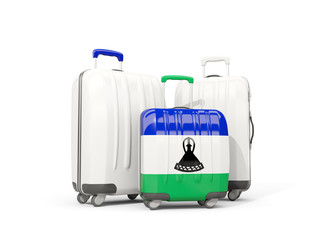 Luggage with flag of lesotho. Three bags isolated on white