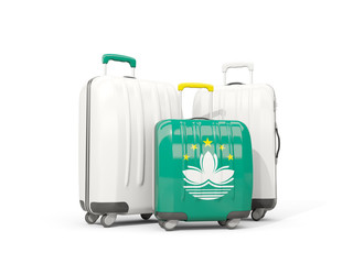 Luggage with flag of macao. Three bags isolated on white