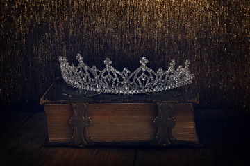 low key of diamond queen crown on old book © tomertu