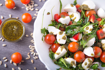 Mixing tasty vegetable salad, closeup