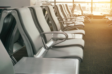 waiting area at airport terminal with empty chairs