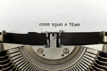 0nce upon a time typed words on a vintage typewriter