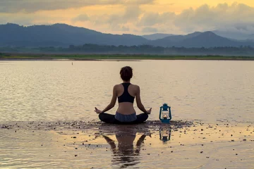 Foto op Canvas meditation and yoga practicing at sunset © seksan94