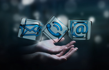 Businessman holding transparent cube contact icon in his hand 3D rendering