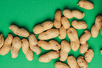 Green background and inshell peanuts