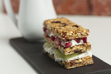 Granola bars served with milk and fruits