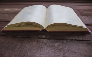 Red book blank on wooden table