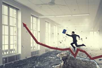 Businessman trying to overcome deep break . Mixed media