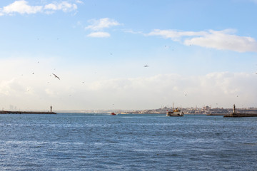 Ferry leaving the port of Kadikoy district, Asian side of the city of Istanbul, Turkey, heading to the European side, Ayasofya mosque can be seen in the background