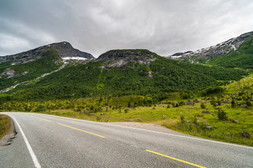 Norwegian country road in the summer amoung the mountains. Sogndal Municipality in Sogn og Fjordane county. Norway.
