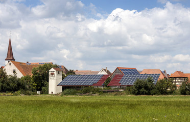 Solar powered homes in a rural village in Germany. Solar panels on roof as alternative energy...