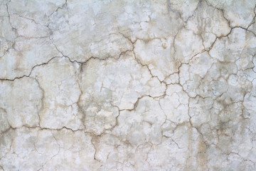 cracks in a white concrete wall