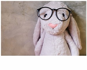 doll wearing glasses with space