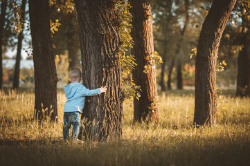 Little boy in fashionable clothing in the park.