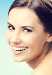 Fototapeta premium Portrait of beautiful woman, on blue