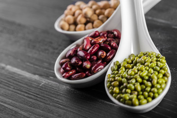 mix of beans on wooden table